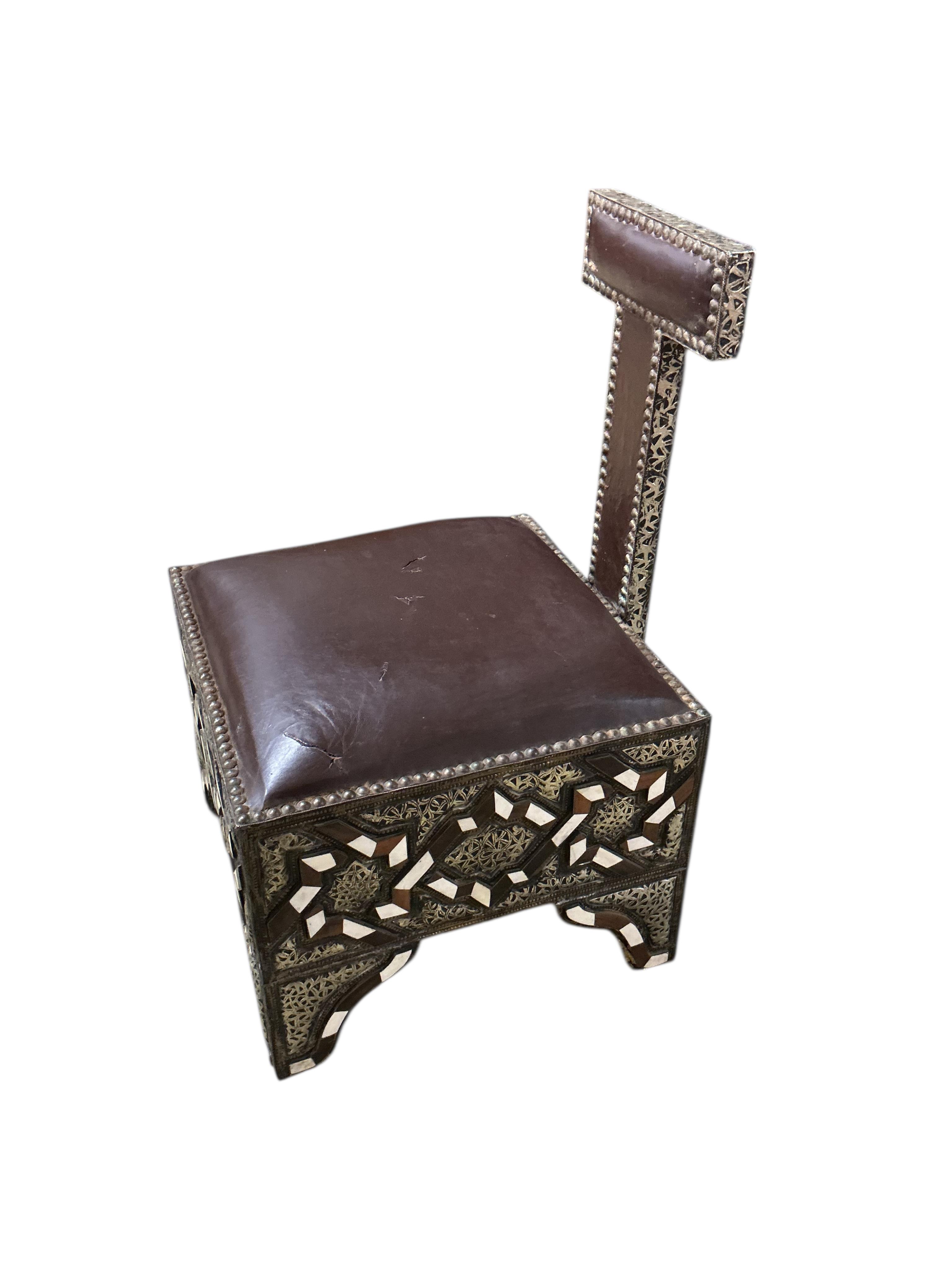 A pair of 20th century Moroccan Berber bone, horn and repousse metal chairs with seats, width 45cm, depth 45cm, height 75cm